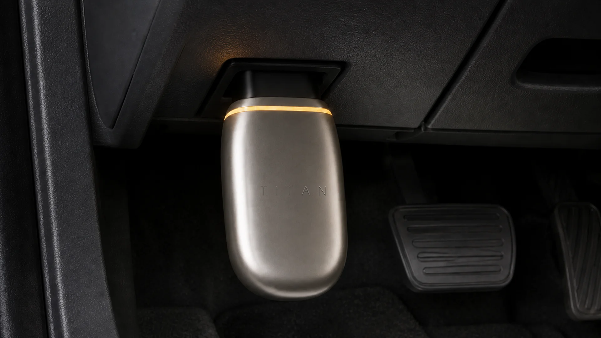 TITAN Link seated in a vehicle's OBD-II port, powered